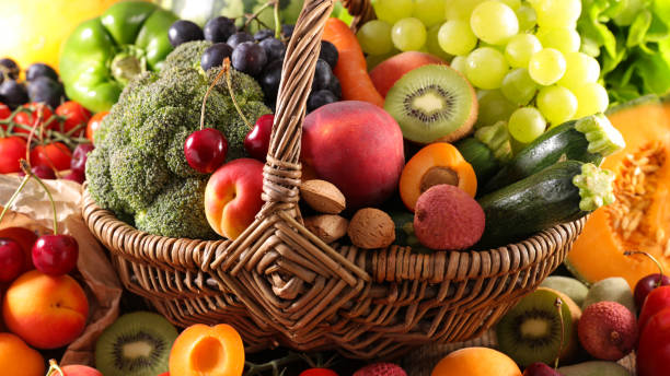 istock assorted of fruit and vegetable in wicker basket 1198651997