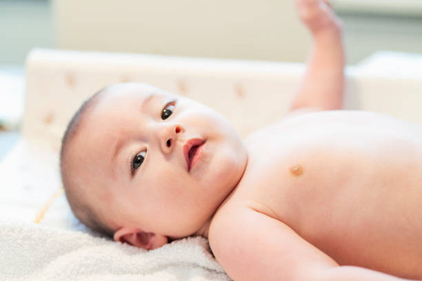 istock Cute baby lying on bed 1198652127