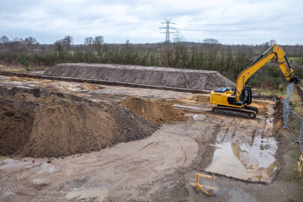 istock on a large construction site, excavators are used to remove topsoil so that a foundation for a large factory building can be built 1198652141