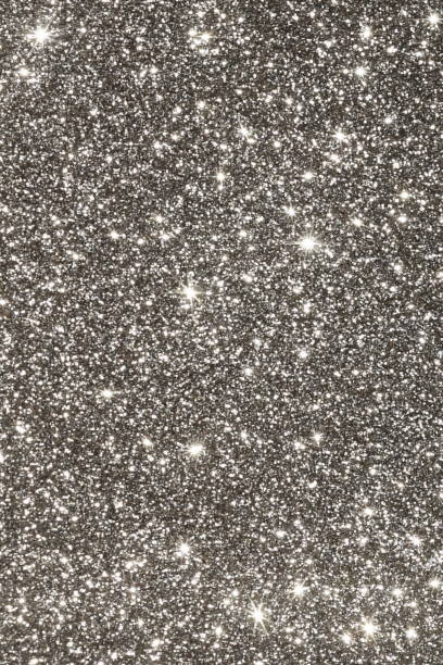blur glitter, bokeh, defocused silver black festive background, texture. Christmas, holiday abstract background.