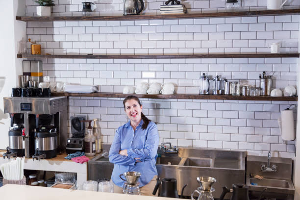 istock Hispanic woman working in coffee shop 1198653560