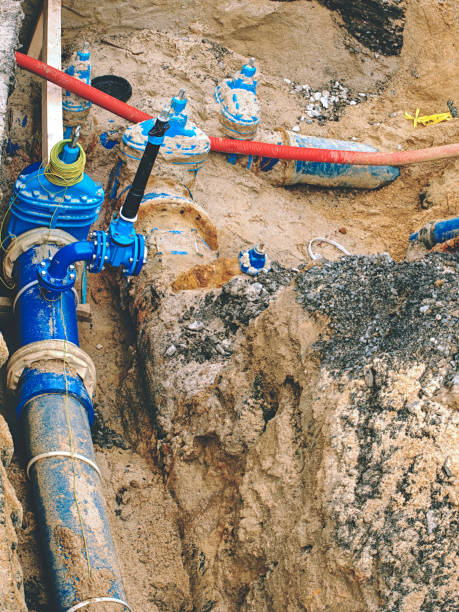 istock Blue water pipes and shut-off valve on pipe with branch 1198653659