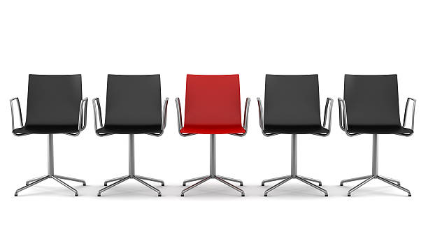 red office chair among black chairs isolated on white background red office chair among black chairs isolated on white background office chair stock pictures, royalty-free photos & images