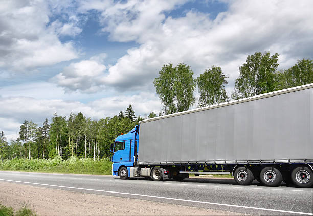 istock blue truck on country highway 119866736