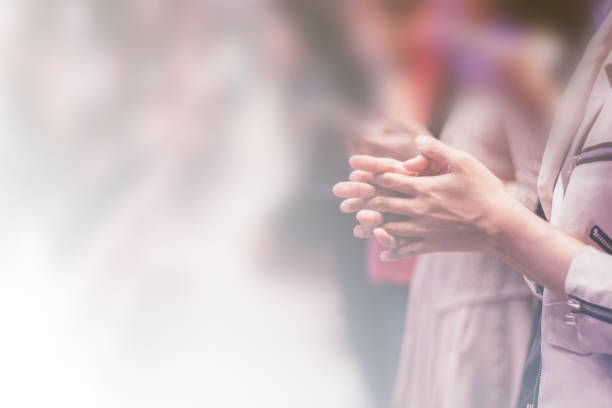 Christian worship with raised hand,music consert. blurred of Christian worship with raised hand,music concert. church like a holy light from god stock pictures, royalty-free photos & images