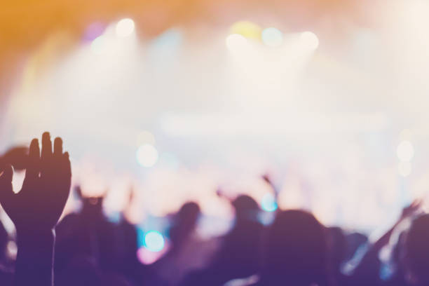 Christian worship with raised hand,music consert. blurred of Christian worship with raised hand,music concert. church like a holy light from god stock pictures, royalty-free photos & images