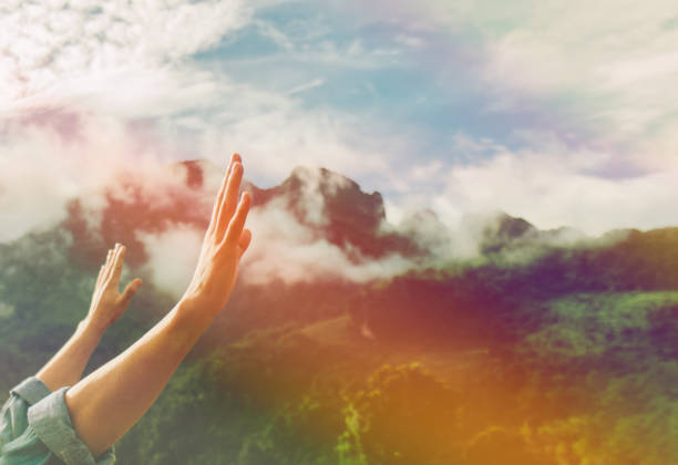 Christian worship with raised hand,music consert. soft focus of Christian worship with raised hand,music concert. church like a holy light from god stock pictures, royalty-free photos & images