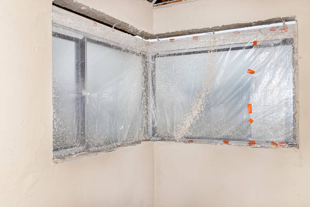 istock Windows in the house being built, protected with foil during the application of cement-lime plaster. 1198672188