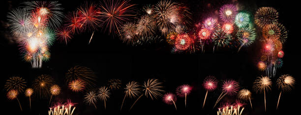 istock colorful fireworks on the black sky background with free space for text. Celebration and anniversary concept 1198672700