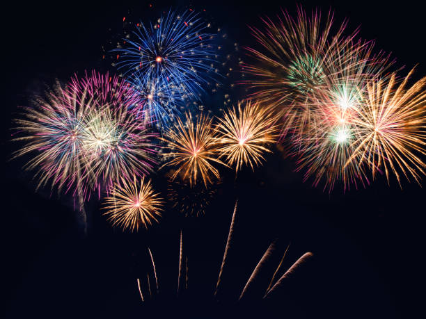 istock colorful fireworks on the black sky background with free space for text. Celebration and anniversary concept 1198673441