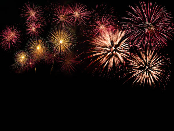 istock colorful fireworks on the black sky background with free space for text. Celebration and anniversary concept 1198673982