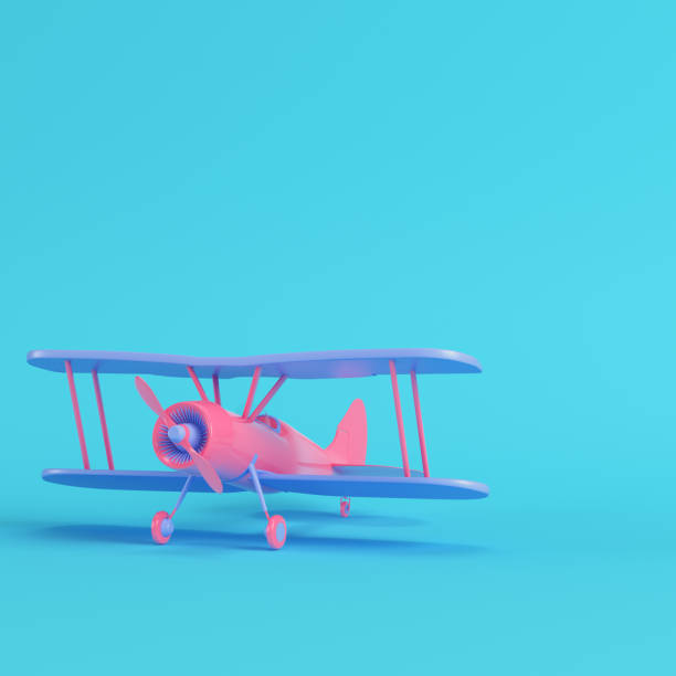 istock Pink biplane on bright blue background in pastel colors. Minimalism concept 1198674544