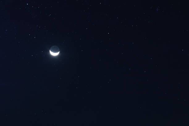 istock New moon and stars in the sky 1198677391