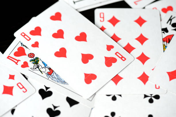 istock Playing cards on a black background close-up. Gambling Concept 1198677928