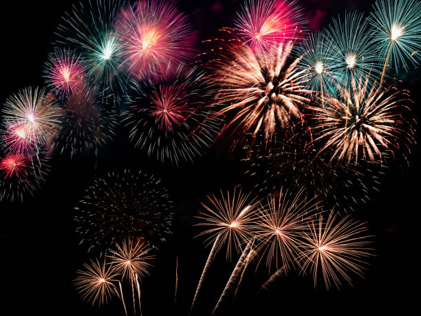 istock colorful fireworks on the black sky background with free space for text. Celebration and anniversary concept 1198677952