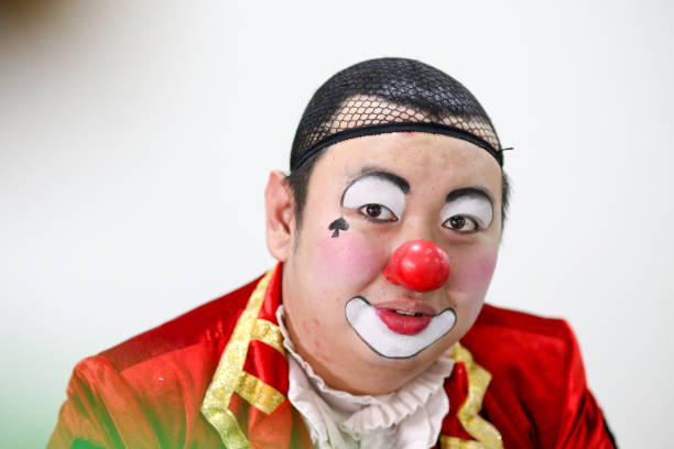 Portrait of clown performer gearing ready for performance.