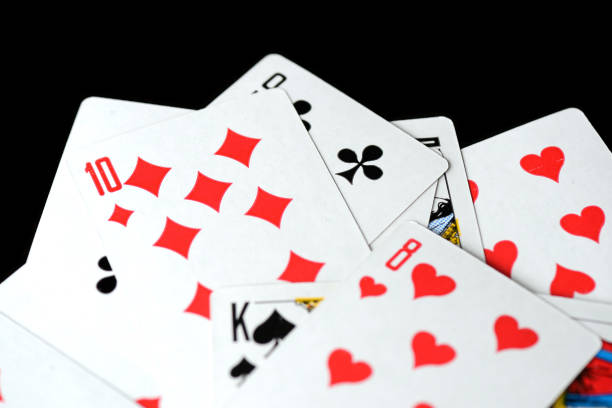 istock Playing cards on a black background close-up. Gambling Concept 1198679223