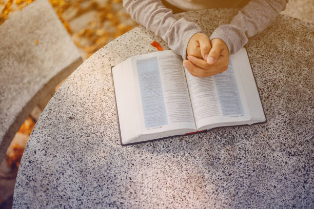 Woman are praying and thanks to the Lord. Woman are praying and thanks to the Lord.girl prayer praying child christianity family stock pictures, royalty-free photos & images