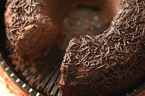 Chocolate cake with chocolate sprinkles.