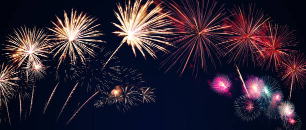 istock colorful fireworks on the black sky background with free space for text. Celebration and anniversary concept 1198686767
