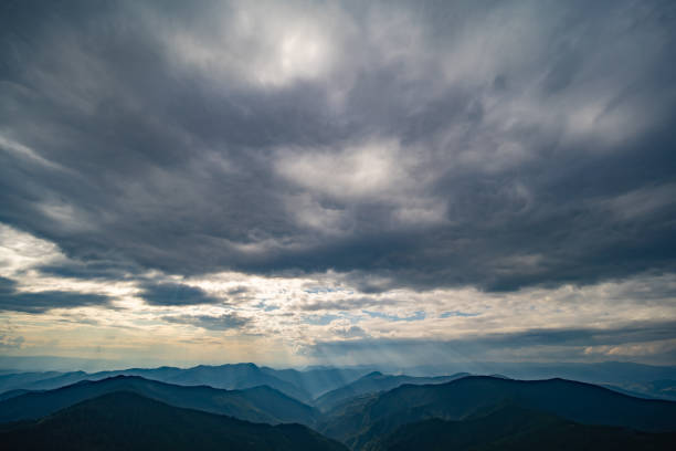 istock The picturesque mountains on the cloud background 1198689196