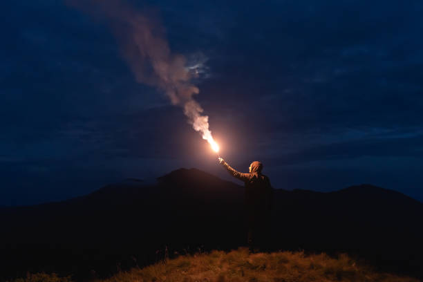 istock The man with a firework stick standing on a mountain 1198689205