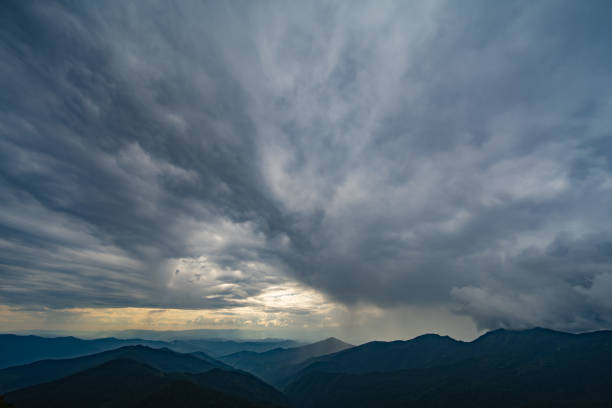 istock The beautiful mountain landscape on the rainy cloud background 1198689236