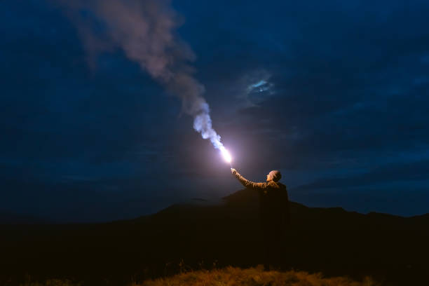 istock The male with a firework stick standing on a mountain 1198689237