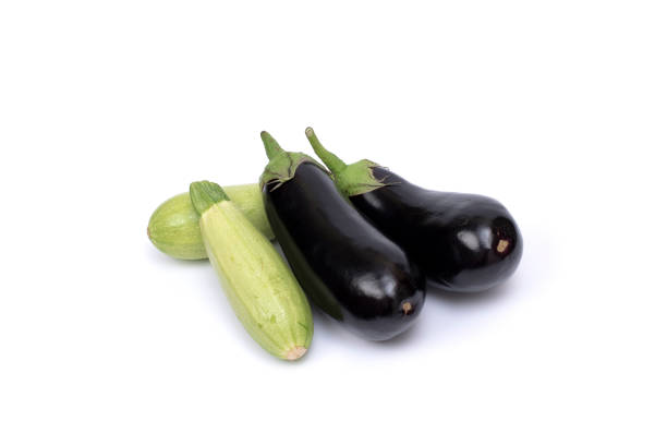 istock Zucchini and eggplant isolated on white background. Fresh vegetable marrow isolated on white background 1198690826