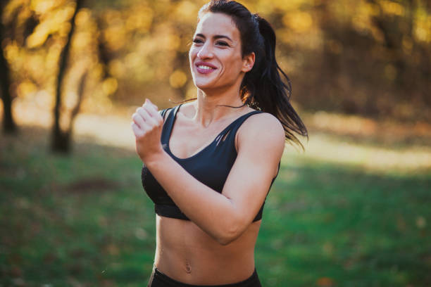 istock Female running in the forest 1198690845