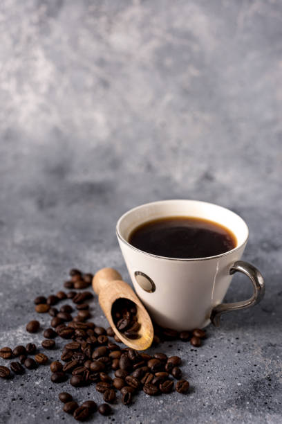 istock coffee cup and coffee beans on a gray background with space for your text 1198691922