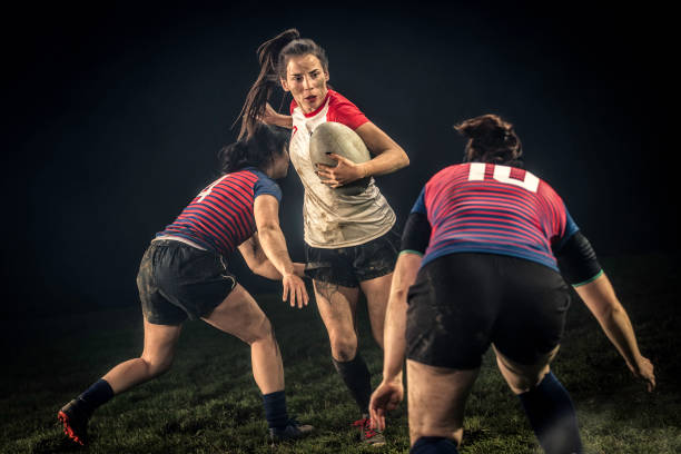 istock Female rugby player running through the defenses 1198693485