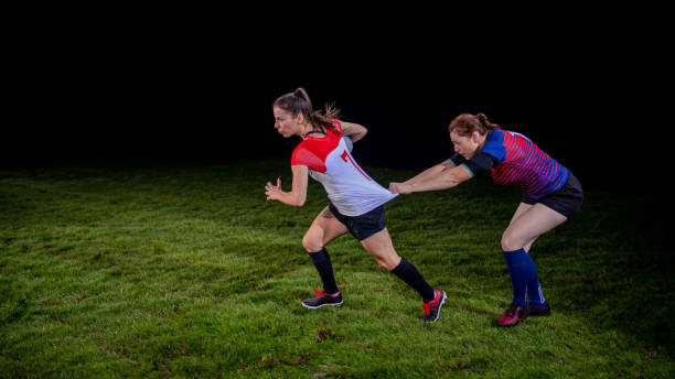 istock Rugby player with the ball getting pulled by the jersey from behind 1198693488