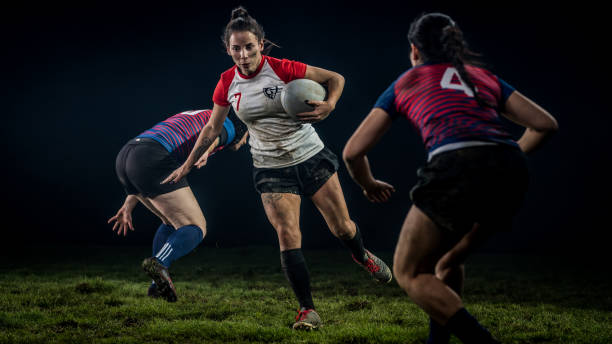 istock Female rugby player dodging the defensive players 1198693521