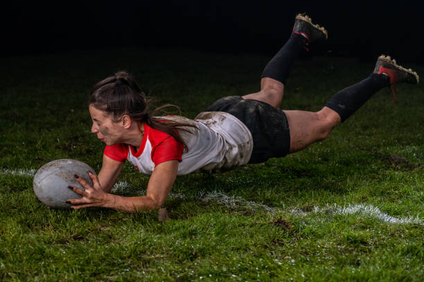 istock Female rugby player scoring a point 1198693522