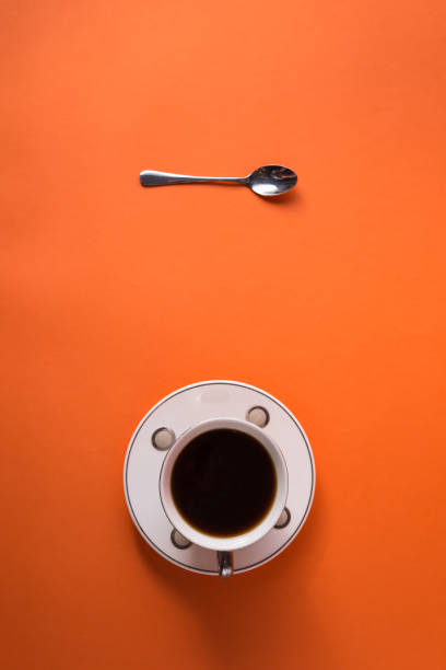 istock cup of aromatic coffee on an orange trendy background with space for text 1198695404