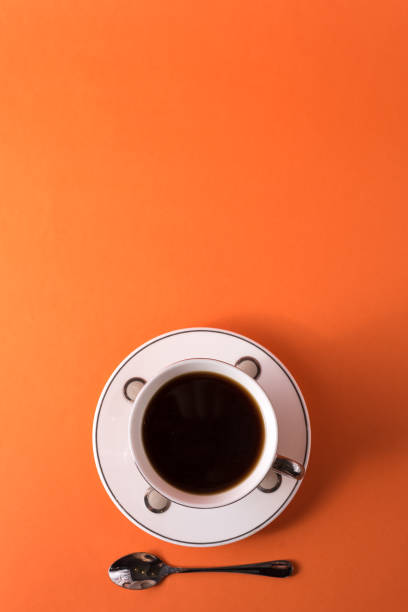 istock cup of aromatic coffee on an orange trendy background with space for text 1198695413