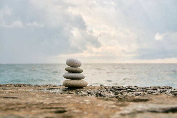 istock Balance, peace of mind, different sizes stones form a pyramid. 1198696528