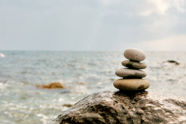 istock Balance, peace of mind, different sizes stones form a pyramid. 1198696617