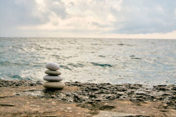 istock Balance, peace of mind, different sizes stones form a pyramid. 1198696700