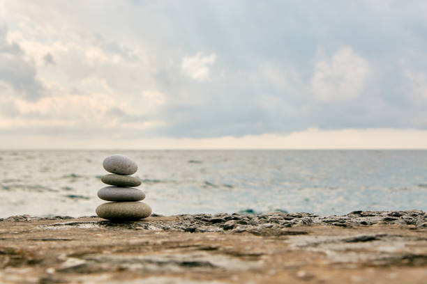 istock Balance, peace of mind, different sizes stones form a pyramid. 1198696716