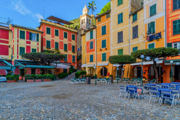 City center of famous coastal italian village Portofino in Liguria, Italy View of the typical italian outdoor cafe at the city center of Portofino in Liguria, Italy portofino photos stock pictures, royalty-free photos & images