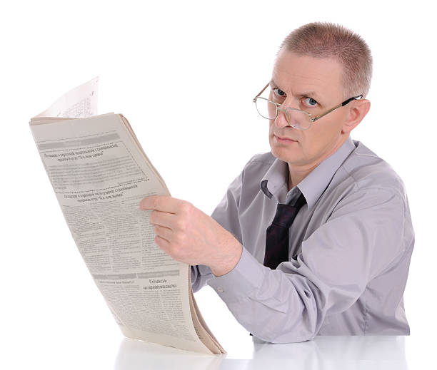 istock Caucasian man reading newspaper. 119869958