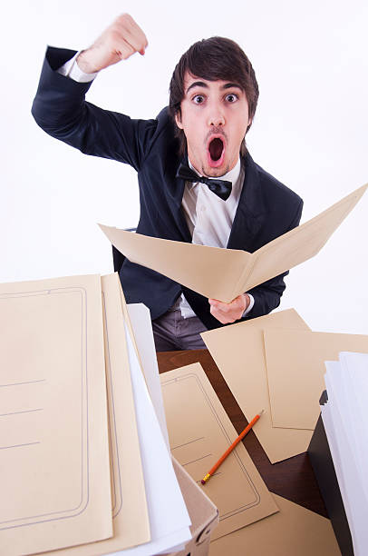 istock Businessman stressed in his office, many documents on the desk 119870192