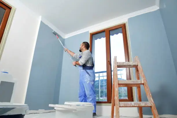 Photo of Painter man at work