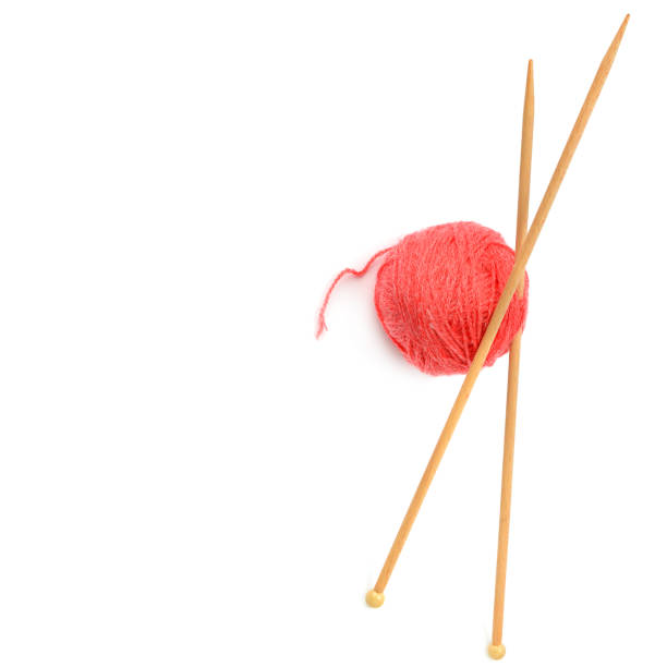 Unravelling knitted fabric on white background