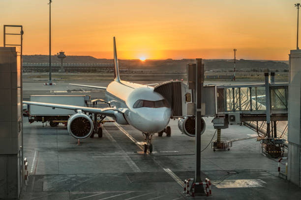 istock Parked airplane at sunrise. 1198704980