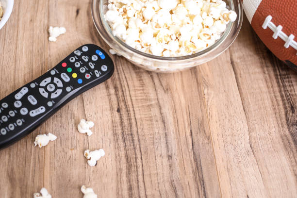 istock Watching the football game with snacks, drinks. 1198709626