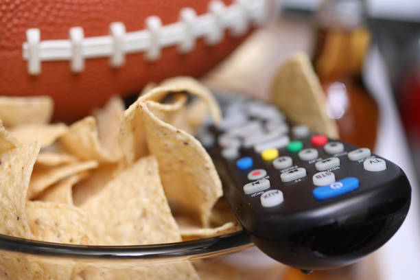 istock Watching the football game with snacks. 1198709715