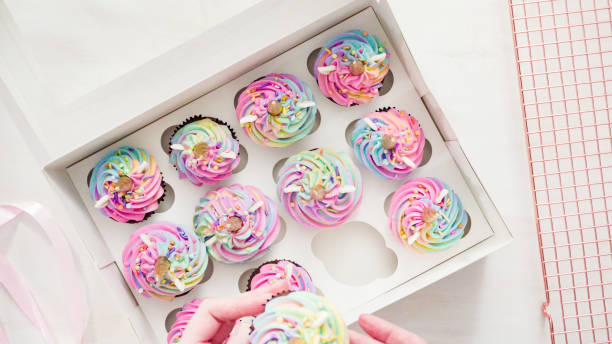istock Boxing unicorn chocolate cupcakes into a white cupcake box. 1198713737